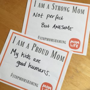 #stopmomshaming placards